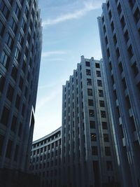 Low angle view of buildings in city against sky