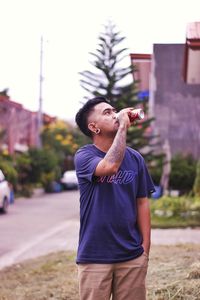 Young man looking away outdoors