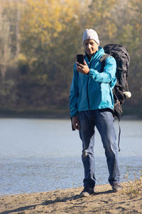 Rear view of man walking on beach