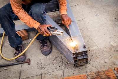 Low section of welder welding metal 