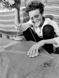 Portrait of smiling boy holding kite