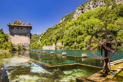 Scenic view of lake against clear blue sky