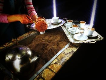 Close-up of person preparing food on table