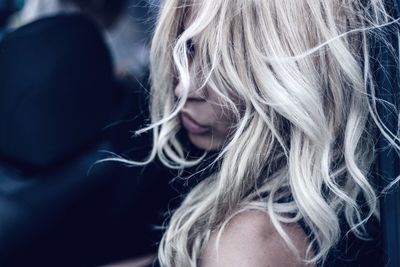 High angle view of woman with messy white hair