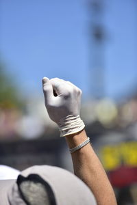 Close-up of human hand against blurred background