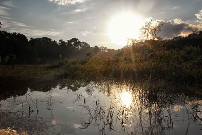 Scenic view of lake against sky during sunset