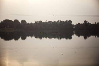 Reflection of trees in calm lake