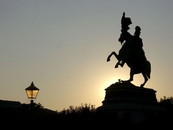 Silhouette statue of st wenceslas at wenceslas square during sunset
