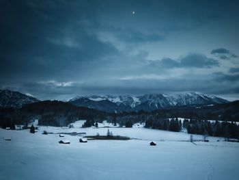 Scenic view of snow covered mountains against sky