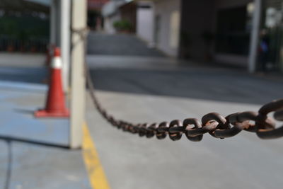 Close-up of chain on street