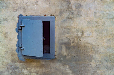 Close-up of closed window on wall