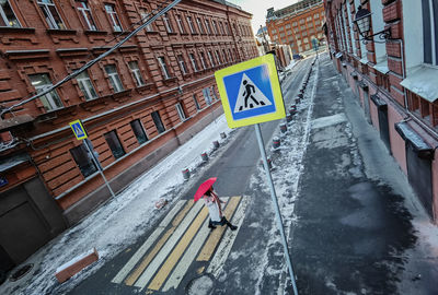 High angle view of road signs on city street