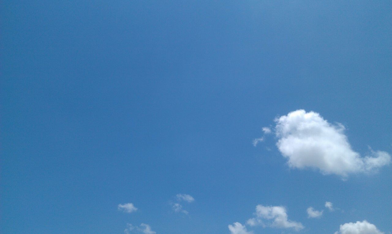 blue, low angle view, sky, copy space, beauty in nature, nature, tranquility, scenics, sky only, cloud - sky, tranquil scene, white color, day, outdoors, no people, cloud, idyllic, white, backgrounds, clear sky