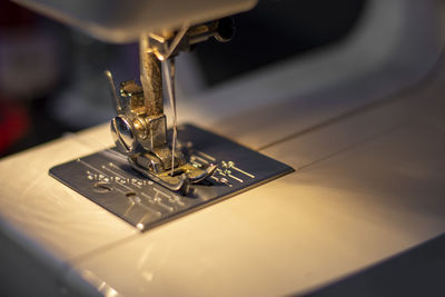 White mechanical sewing machine in the dark