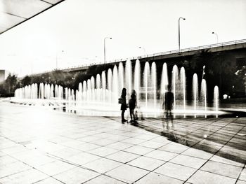 People walking on bridge