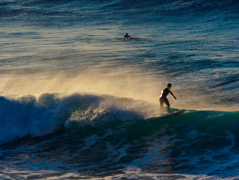 High angle view of man surfing in sea