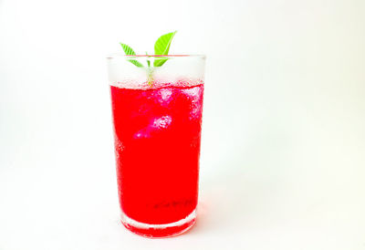 Close-up of drink against white background