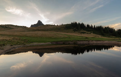 Scenic view of lake against sky in ciucas mountains 