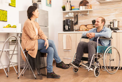 Friends sitting on chair