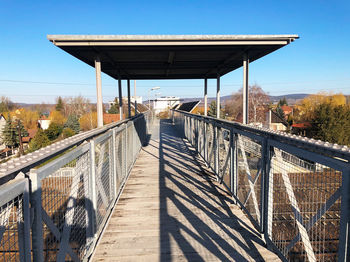 View of footbridge against sky