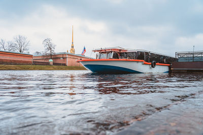 A boat on the pier at the peter and paul fortress in the center of st. petersburg