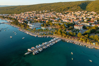 High angle view of townscape by sea