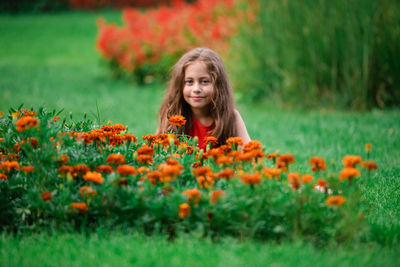 Portrait of girl smiling on field