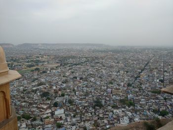 Aerial view of cityscape against sky