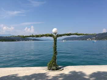 Scenic view of ball in sea against sky