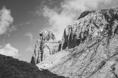 Low angle view of rock formation against sky