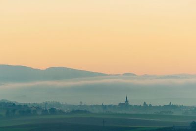 Scenic view of landscape against sky during sunset