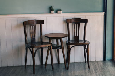 Empty chairs and table in restaurant