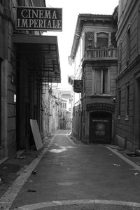 Road amidst buildings in city