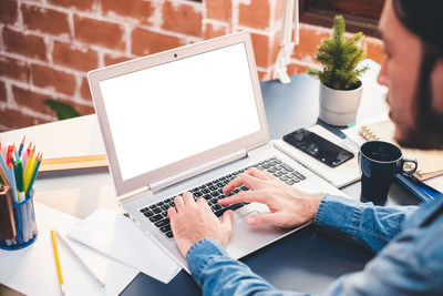 Low angle view of woman working on table