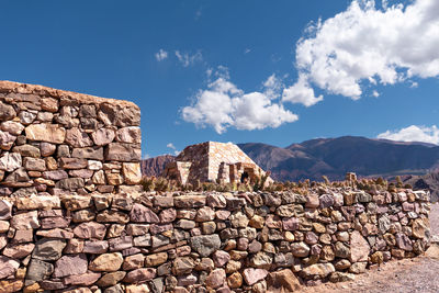 View of rocky mountains against sky