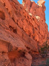 Low angle view of rock formation against sky