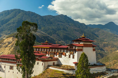 High angle view of townscape and mountains against sky