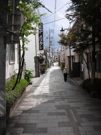 Empty alley amidst buildings in city