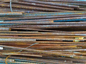 Directly above shot of rusty metal rods at construction site