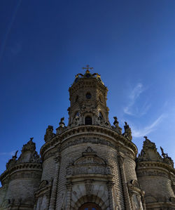 Low angle view of a building against blue sky