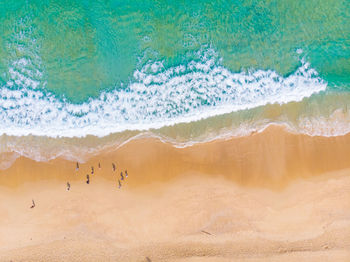 Aerial view of people enjoying at beach