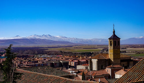 High angle view of townscape against clear blue sky