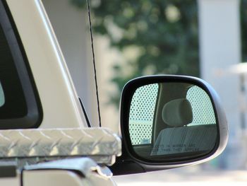 Close-up of car seat on side-view mirror