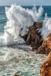 Waves breaking on rocks