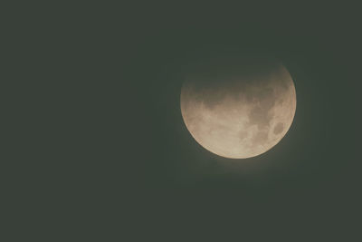 Low angle view of moon against clear sky at night