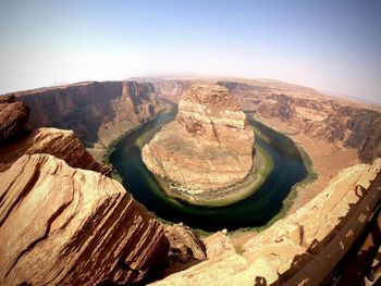 High angle view of rock formations against sky horseshoe bend