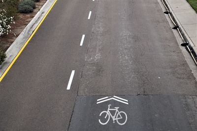 High angle view of arrow symbol on road