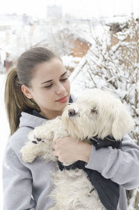 Woman with dog outdoors