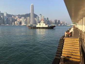 View of ship in sea against buildings