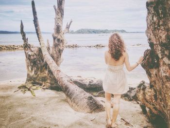 Woman standing on beach